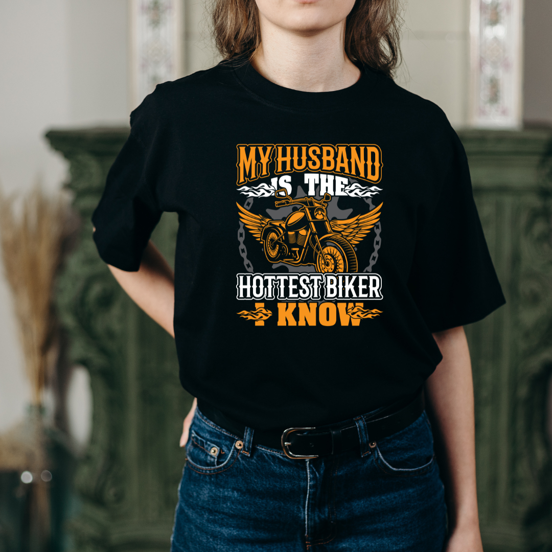 MY HUSBAND IS THE HOTTESTE BIKER UNISEX T-SHIRT
